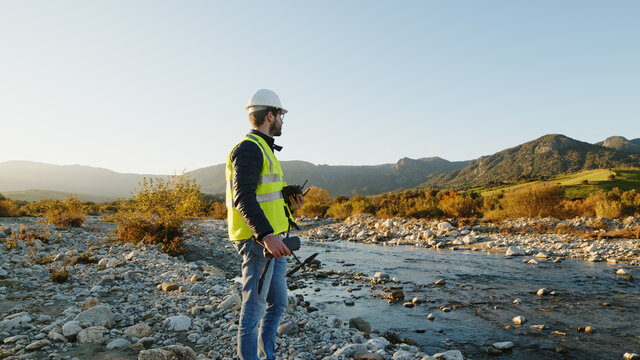 engineer with drone controls the territory