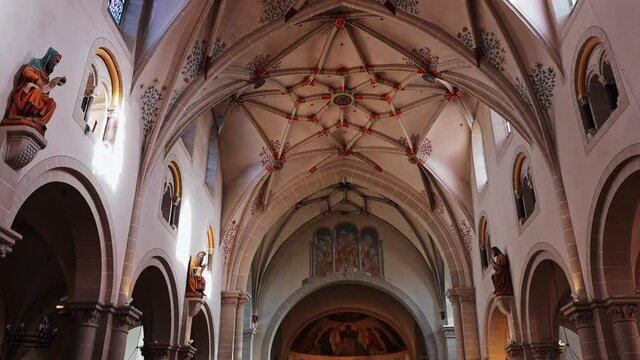 Panning view of interior of beautiful Basilica of St. Castor, Koblenz, Germany Tilt down