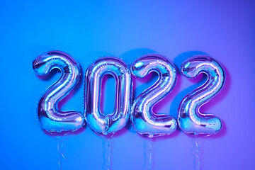 From above number balloons Christmas or New Year Decorative design elements neon background