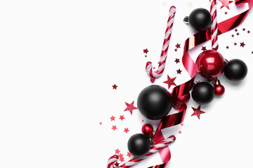 Beautiful Christmas composition with balls and candy canes on white background