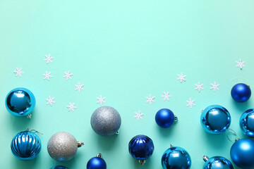 Stylish Christmas balls on green background