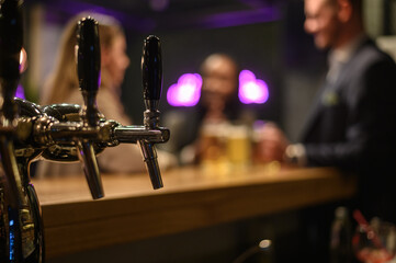 Close shot of beer tap in a bar