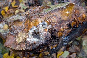 Quartz brush on a flint boulder in nature