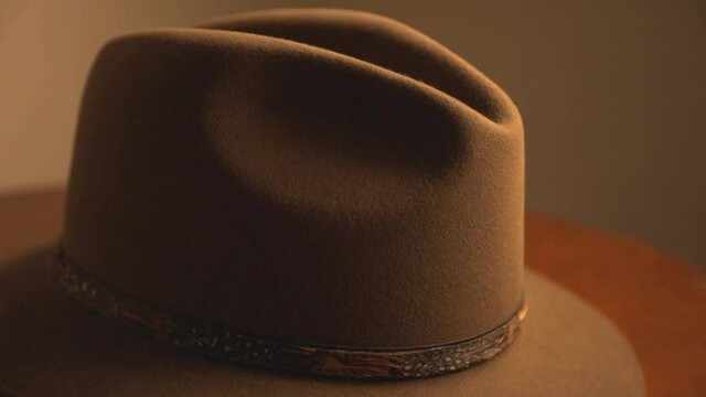 Light And Shadows Through Brown Fedora Hat. Closeup