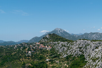 Mountain rocky landscape with the Dalmatian settlement of Podgradje, Croatia, during the summer