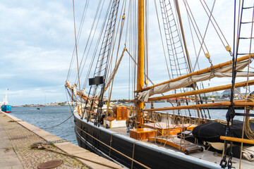 Copenhagen, Denmark - October 1, 2021: old boats along the Larsens PI in Copenhagen harbor