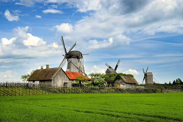 Obraz na płótnie Canvas Wooden windmills, typical for estonian pre-war countryside. Angla, Saaremaa island, Estonia, Europe.