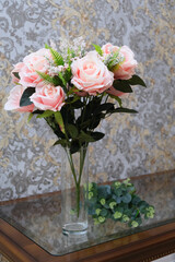 Bouquet of artificial  roses in crystal vase, home decor