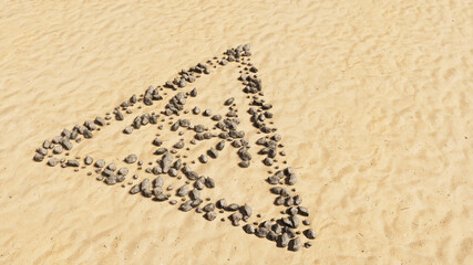 Concept conceptual stones on beach sand handmade symbol shape, golden sandy background, toxic icon. 3d illustration metaphor for danger, warning, caution,  biohazard and environment contamination
