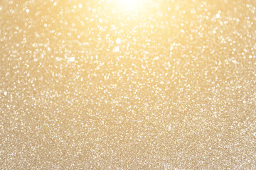 Glitter sparkling gold texture. Celebration bokeh blurred background.