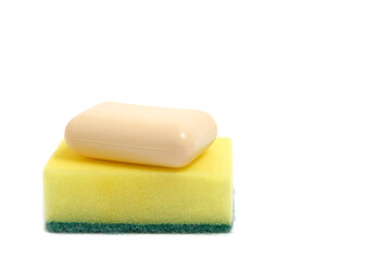 Sponge for washing dishes piece of soap on a white background.