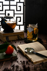 Winter home still life. Indoor comfortable relaxing corner with hot tea pot and books