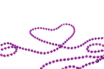 Purple beads a heart shaped on white background. A beautiful chain. Decorative element.