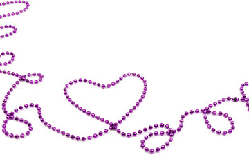 Purple beads a heart shaped on white background. A beautiful chain. Decorative element.