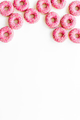 Group of glazed pink donutes. Sweet bakery background