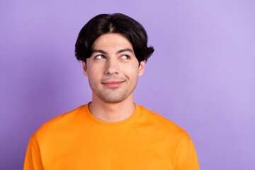 Photo of young dreamy happy positive man look empty space imagine wonder isolated on purple color background