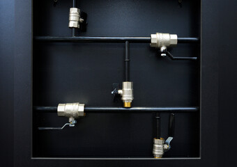 Ball valves placed on a stand. Plumbing equipment