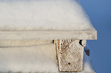 A lot of snow on the board. Snowy winter. Winter background. cold.