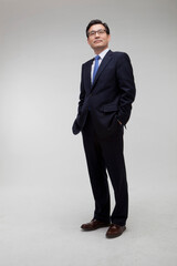 Middle-aged business man wearing a suit and posing
