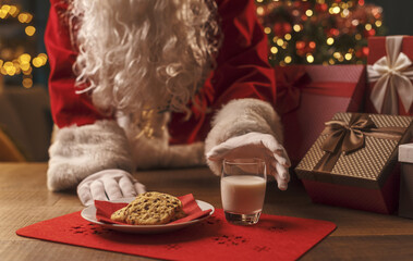 Santa Claus having a delicious snack