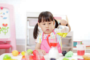 young  girl pretend play food preparing at home