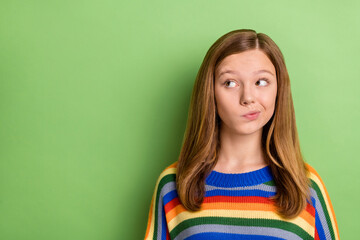 Portrait of attractive pensive funny girly girl making decision copy blank space isolated over bright green color background