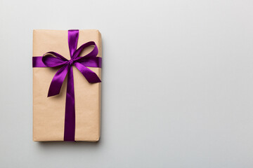 Holiday present box over colored background, top view. Copy space for design