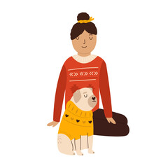 Young girl in a sweater sitting with her pug dog in holiday clothing