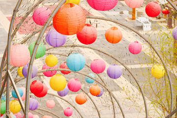 Fototapeta na wymiar Colorful lanterns hanging outdoors in Asian festivals