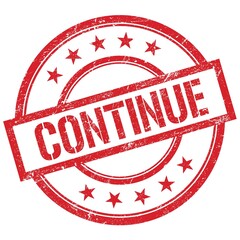 CONTINUE text written on red vintage stamp.