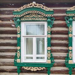 beautiful carved windows on wooden houses