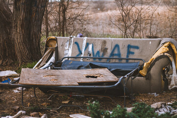 Damaged old bench in the field of Forth Worth in United States