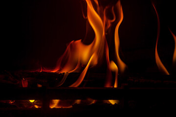 The play of flames in the fireplace. The burning of wood. Fire in the fireplace. Copy space.