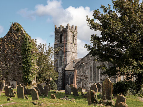 Eerie scenery of an ancient graveyard by a medieval cathedral in Dungarvan, Ireland