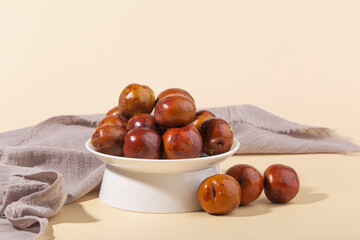 Jujube or Monkey apple fruit isolated on yellow background.