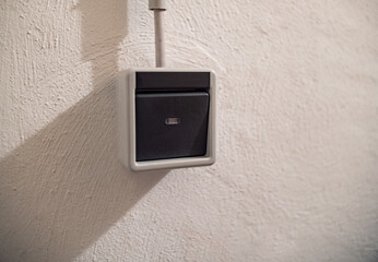 Light switch in the basement on the wall. 