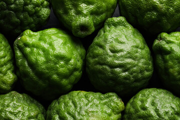 Fresh ripe bergamot fruits as background, top view