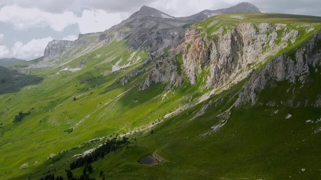 Green valleys with lakes in the mountains. Drone filming.
Green valleys with lakes in the mountains. Drone filming. Caucasian State Natural Biosphere Reserve named after Kh.G. Shaposhnikov. Oshten mou