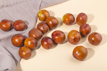 Jujube or Monkey apple fruit isolated on yellow background.