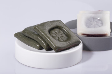 Korean traditional rice cake called jeolpyeon. bean jam filling pounded rice cake.