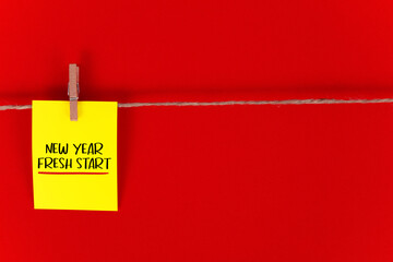 New Year, fresh start. on red background.