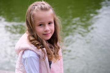 Portrait of pretty child girl outdoors