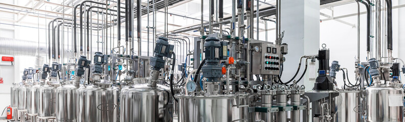 Panoramic photo of pipes and tanks. Chemistry and medicine production. Pharmaceutical factory....