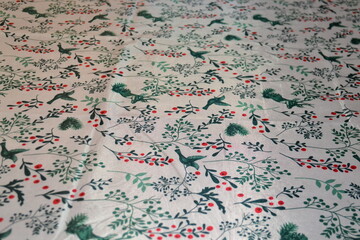Fototapeta premium christmas table tablecloth white background green red