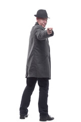 rear view. intelligent man in a hat and autumn coat .