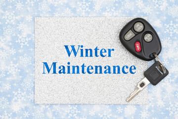 Winter Maintenance on silver card with car key on blue and white snowflakes
