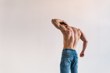 young man, brutal appearance, with a beautiful torso, bodybuilder, in the studio on a white background, BW photo