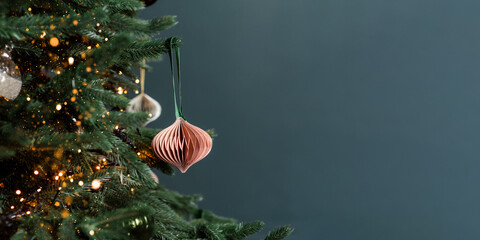 Christmas handmade eco decoration toy on fir tree and garland.