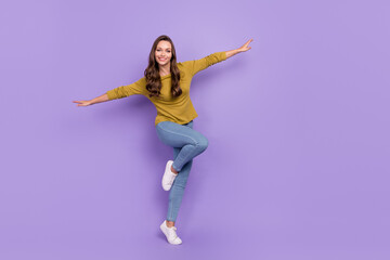 Fototapeta na wymiar Full size portrait of satisfied glad person arms flying toothy smile isolated on violet color background