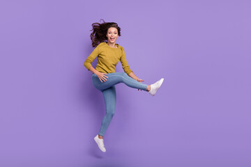Fototapeta na wymiar Full length photo of excited cheerful person hands hold leg toothy smile isolated on purple color background
